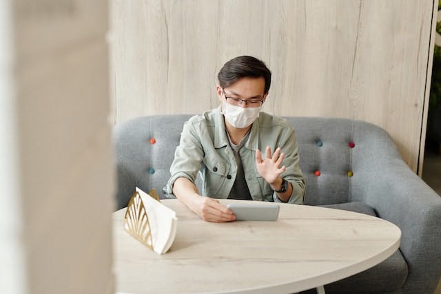 Man during telehealth appointment on smartphone