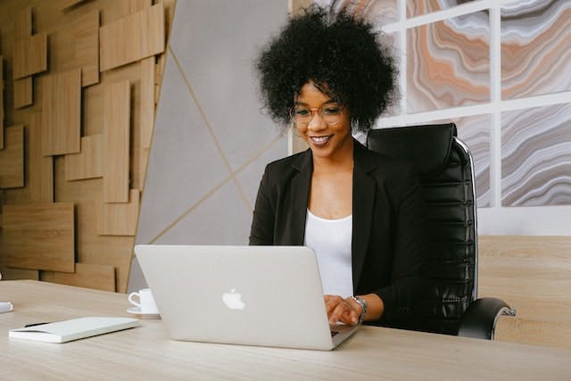 woman video chatting with therapist