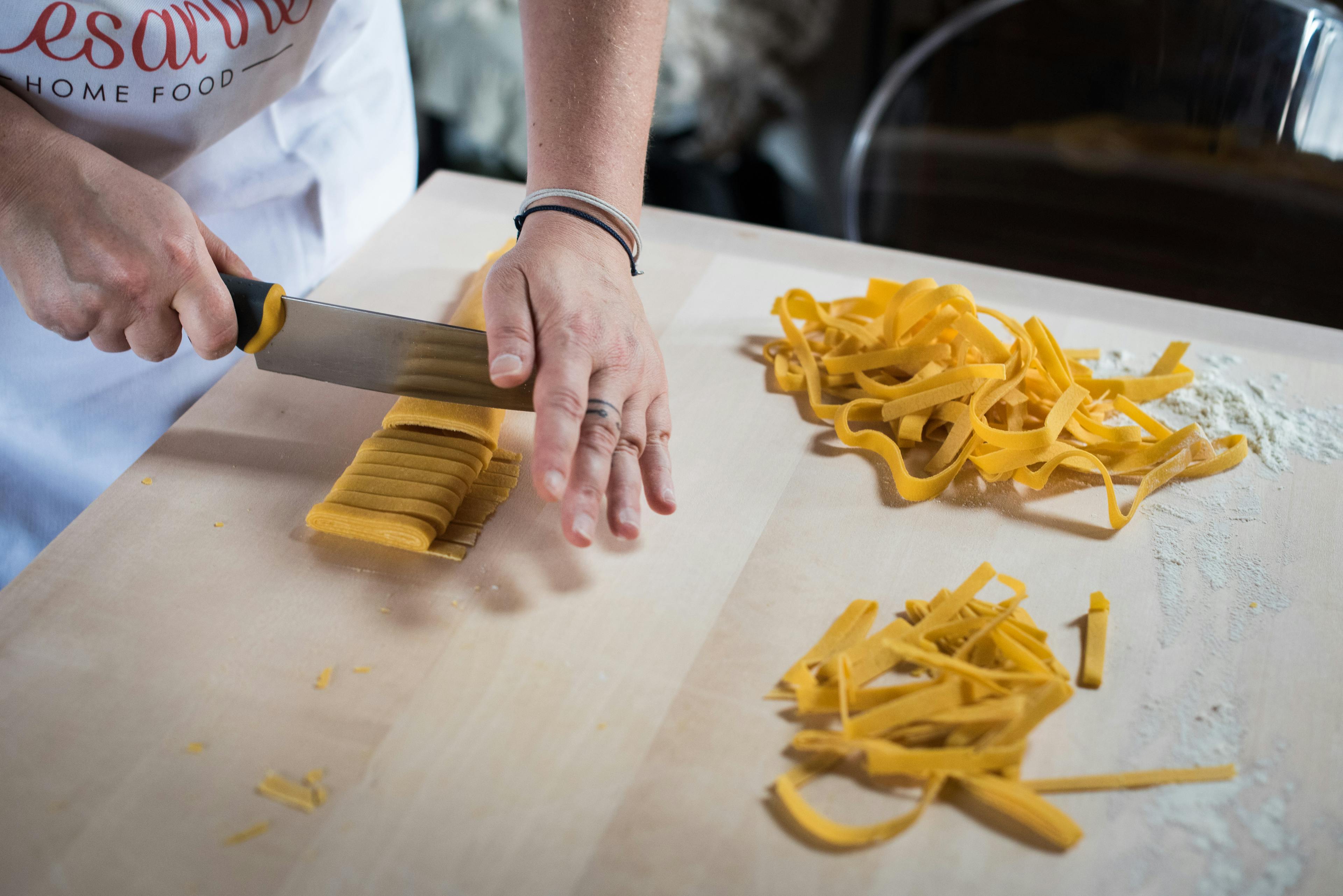 Preparation of tagliatelle on a cutting board