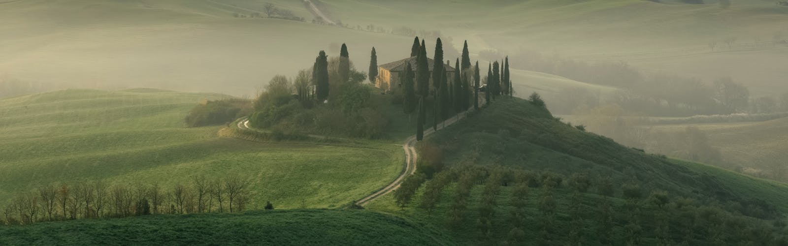 View of Tuscan hills with layers of mist