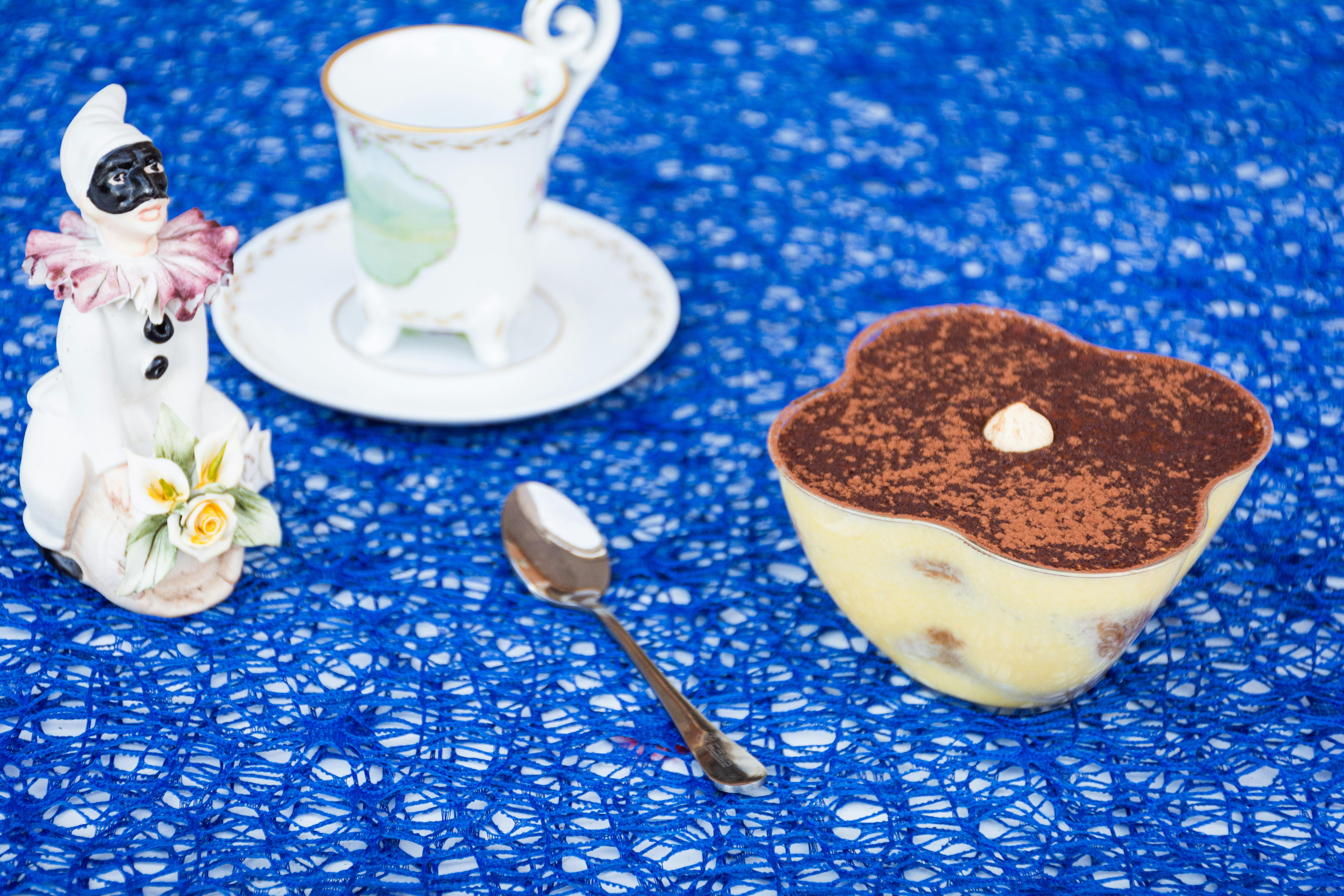 Tiramisù on the table with a cup of coffee