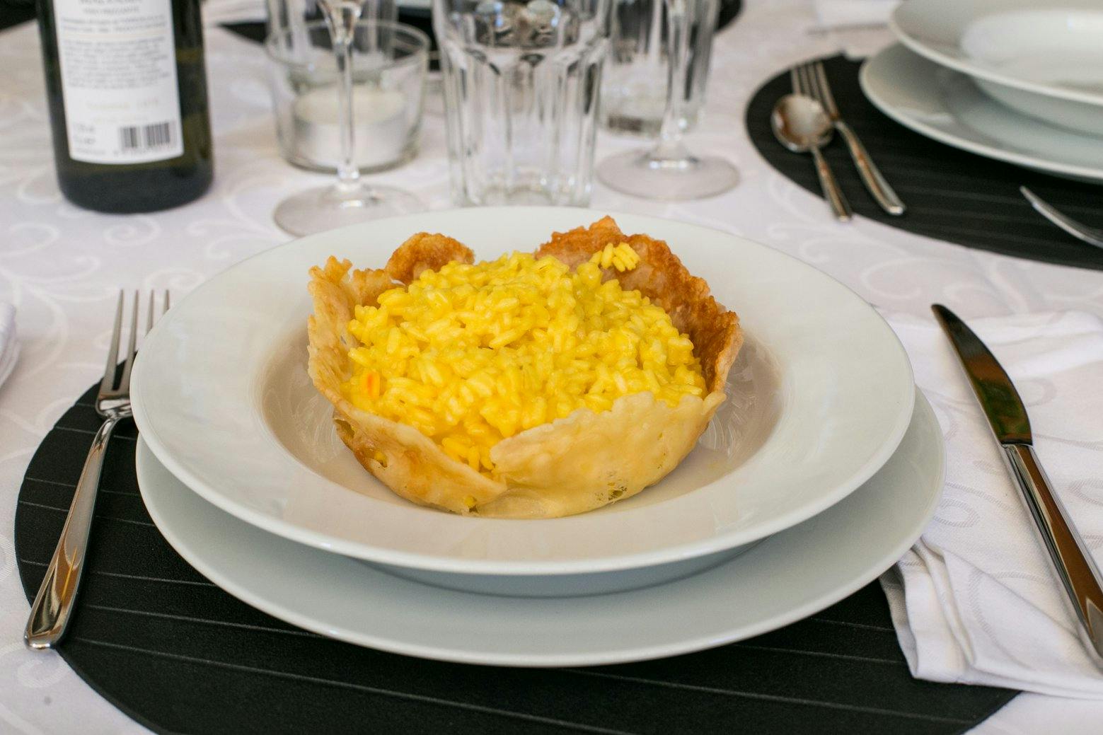 Milanese risotto served in a Parmesan cheese basket