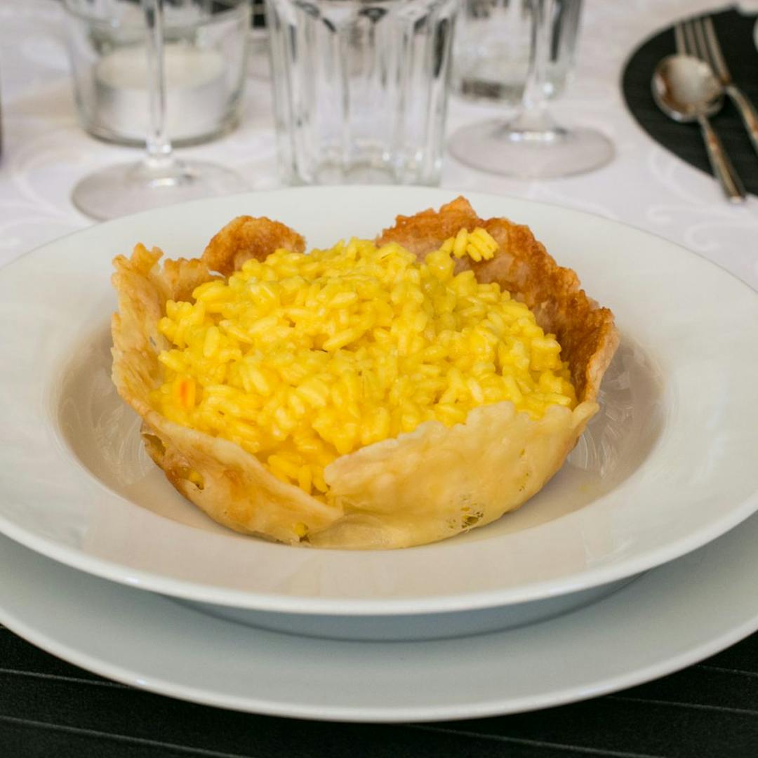 Risotto alla Milanese served in a Parmesan crisp