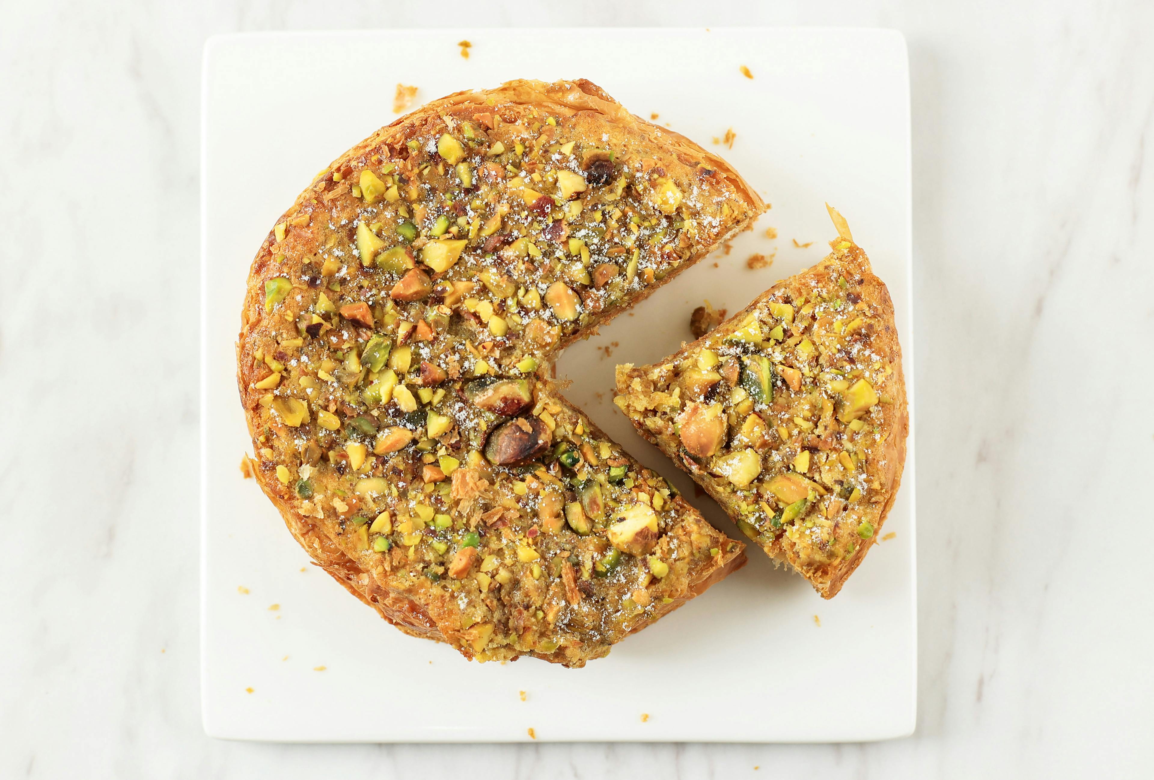 Pistachio cake on table seen from above