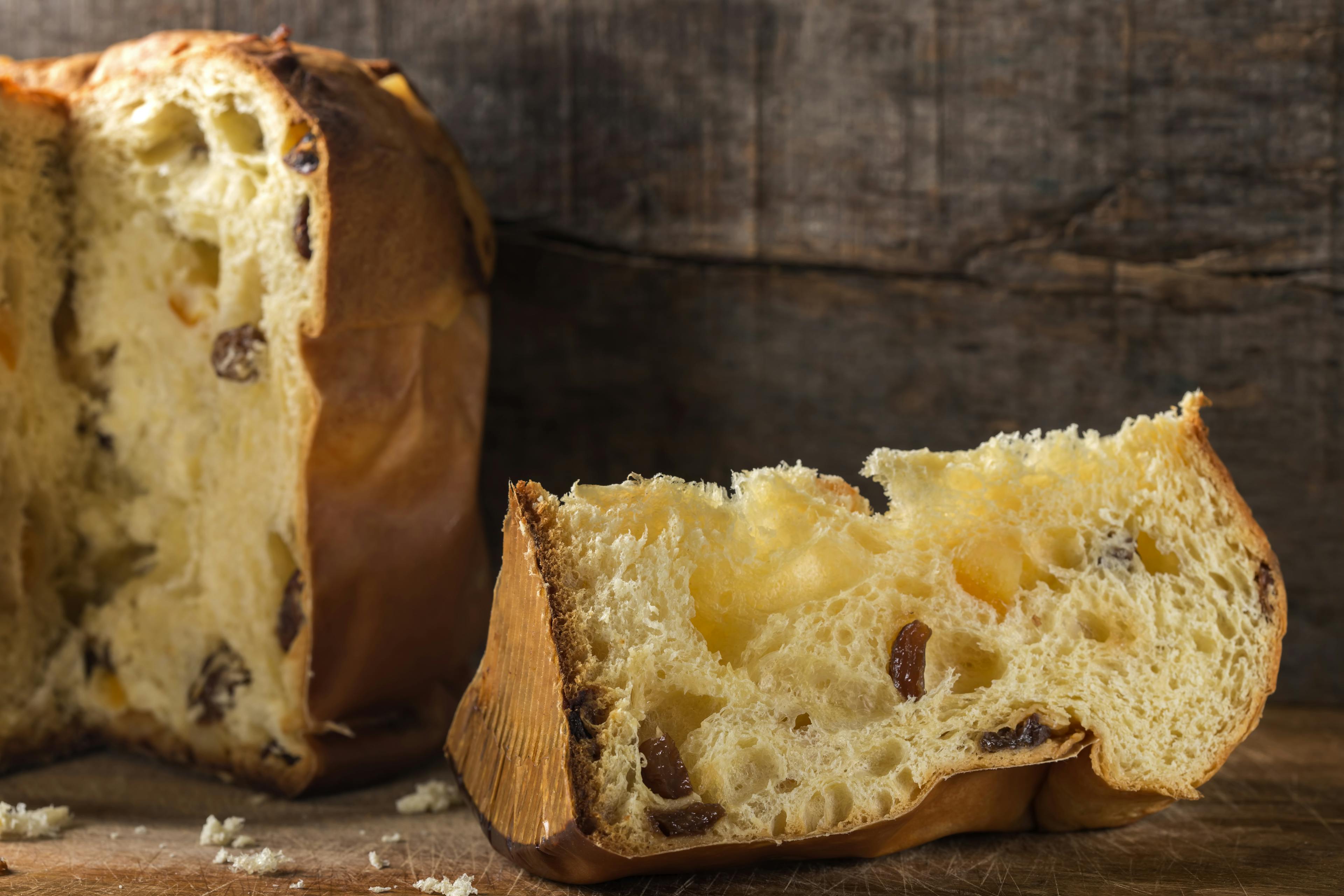 Panettone with a slice cut beside it