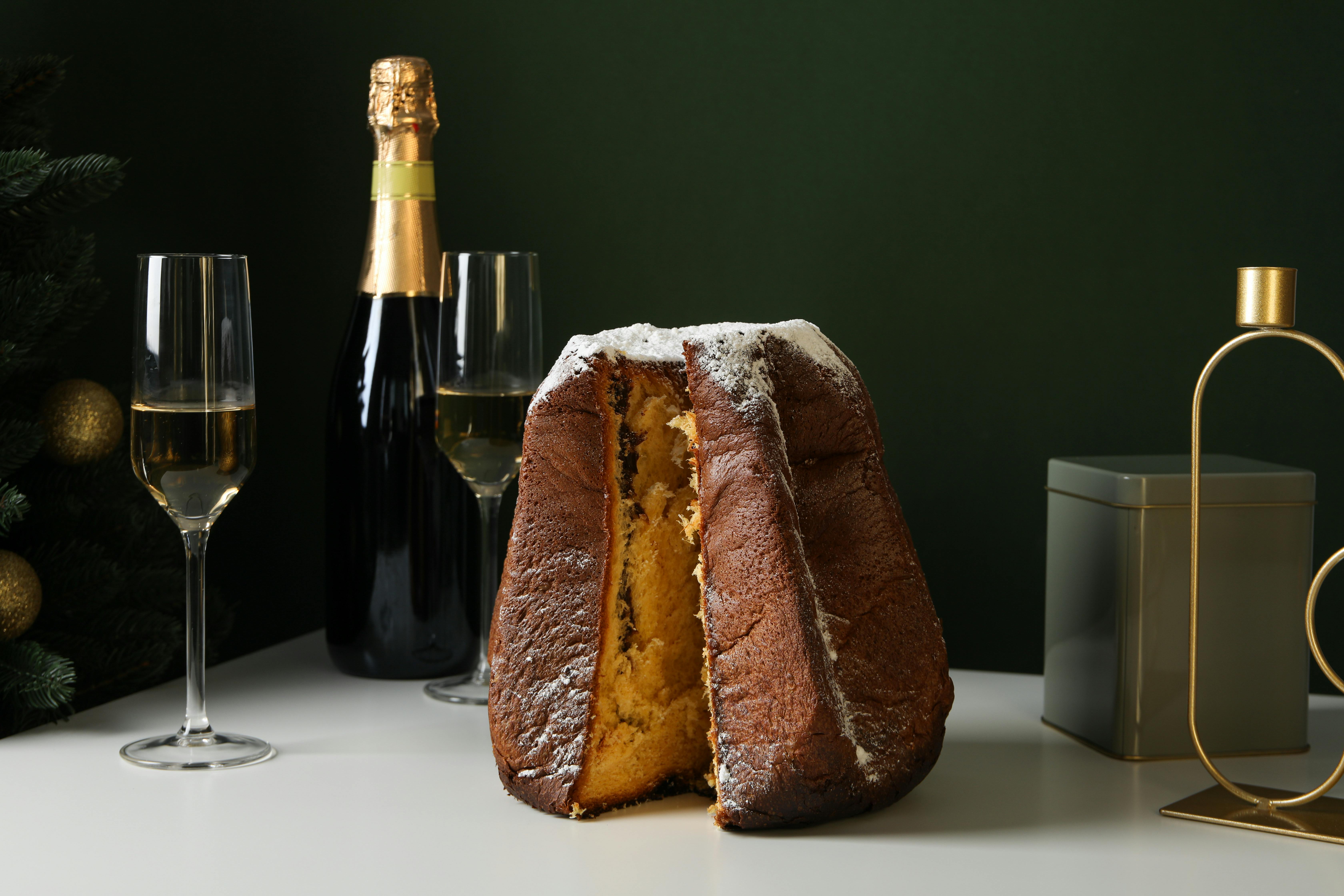 Table with pandoro and a bottle of sparkling wine