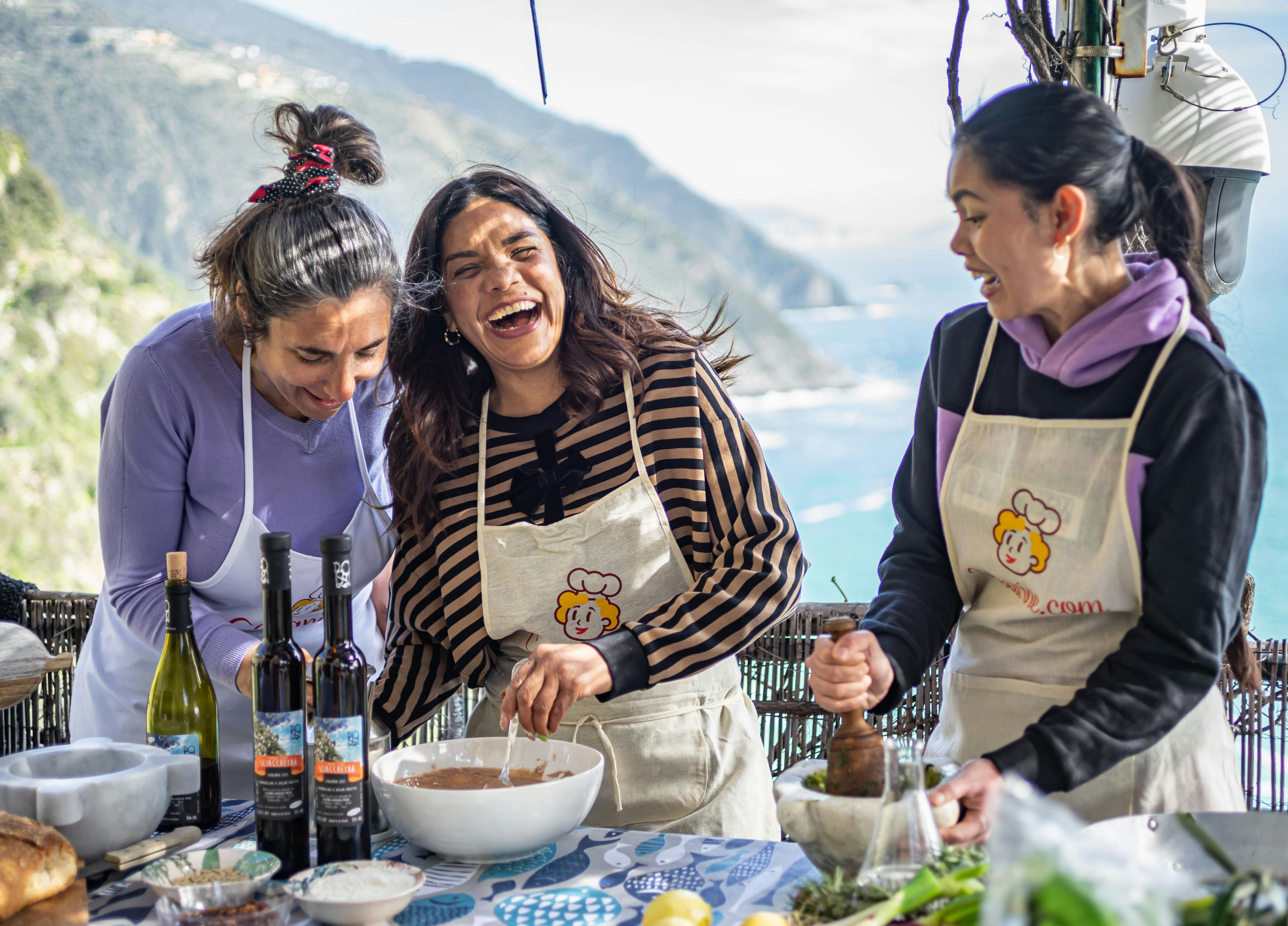 People laughing and doing a cooking class in Cinque Terre