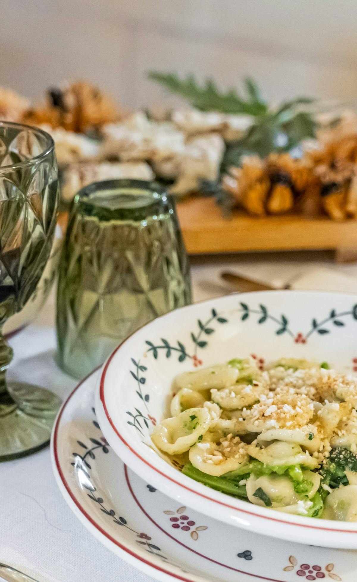 Plate of orecchiette with turnip greens on a set table