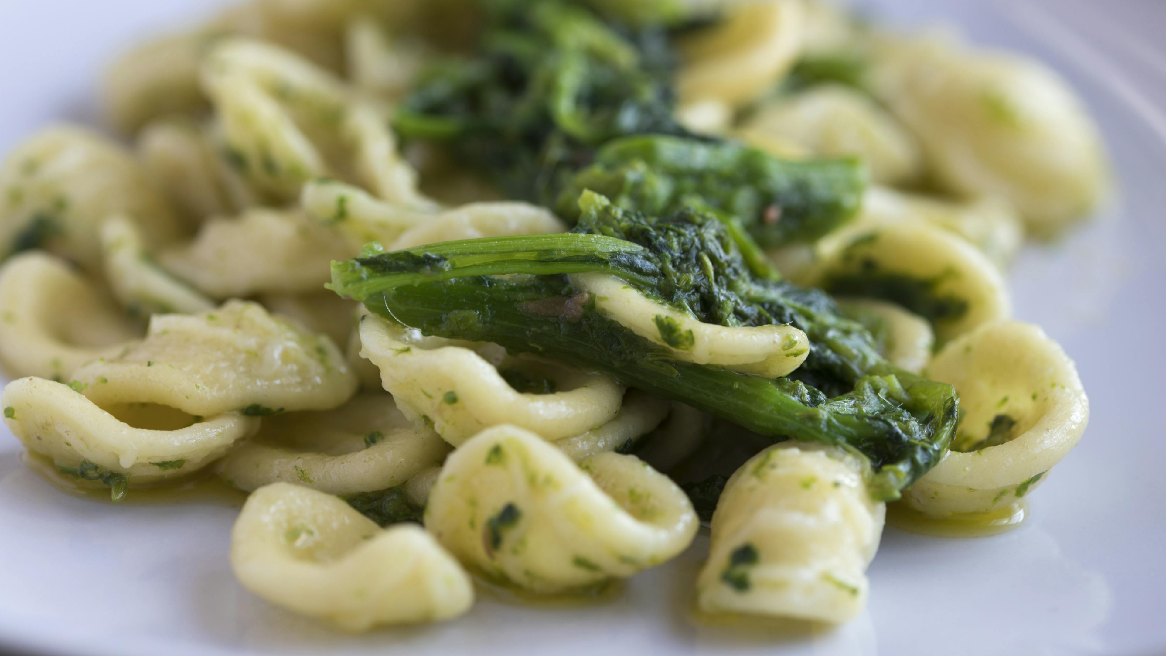 Close-up of a plate of orecchiette with turnip tops