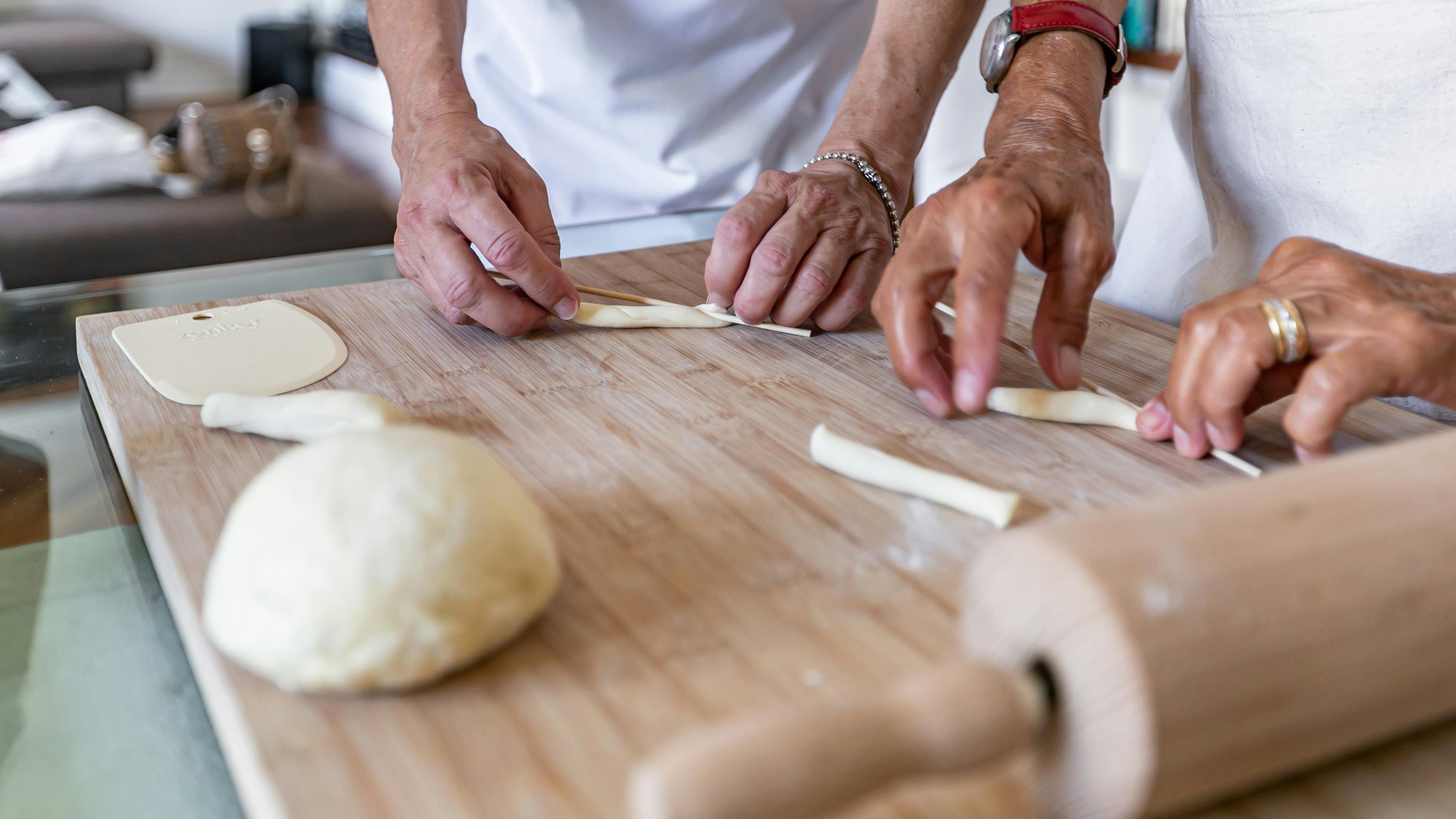 Preparation of busiate on a cutting board