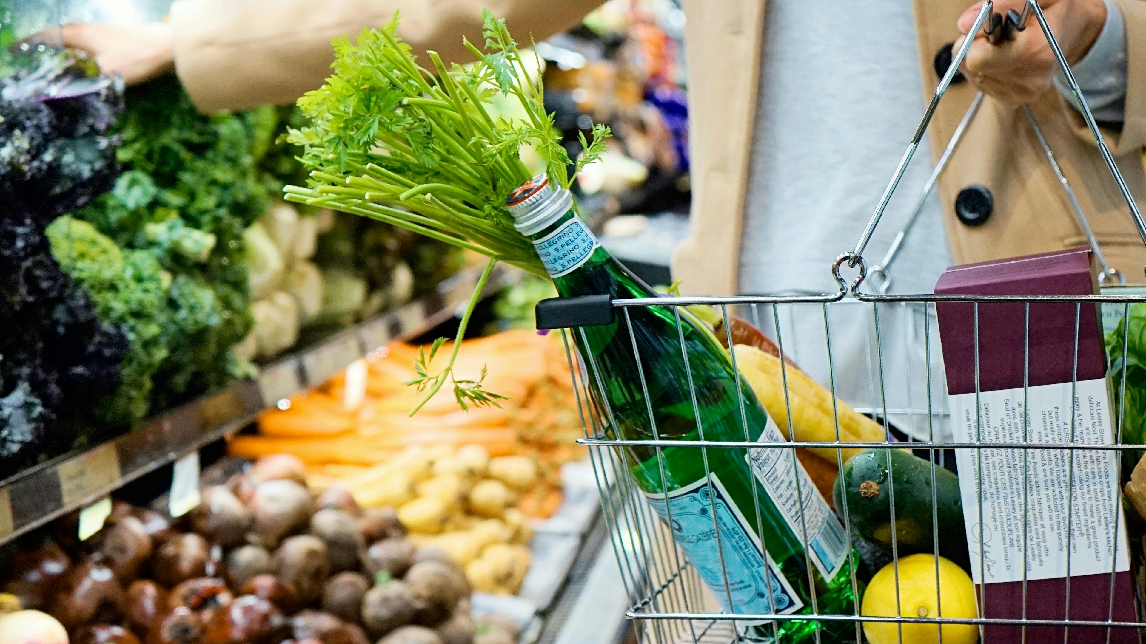 Customer placing products in the shopping basket