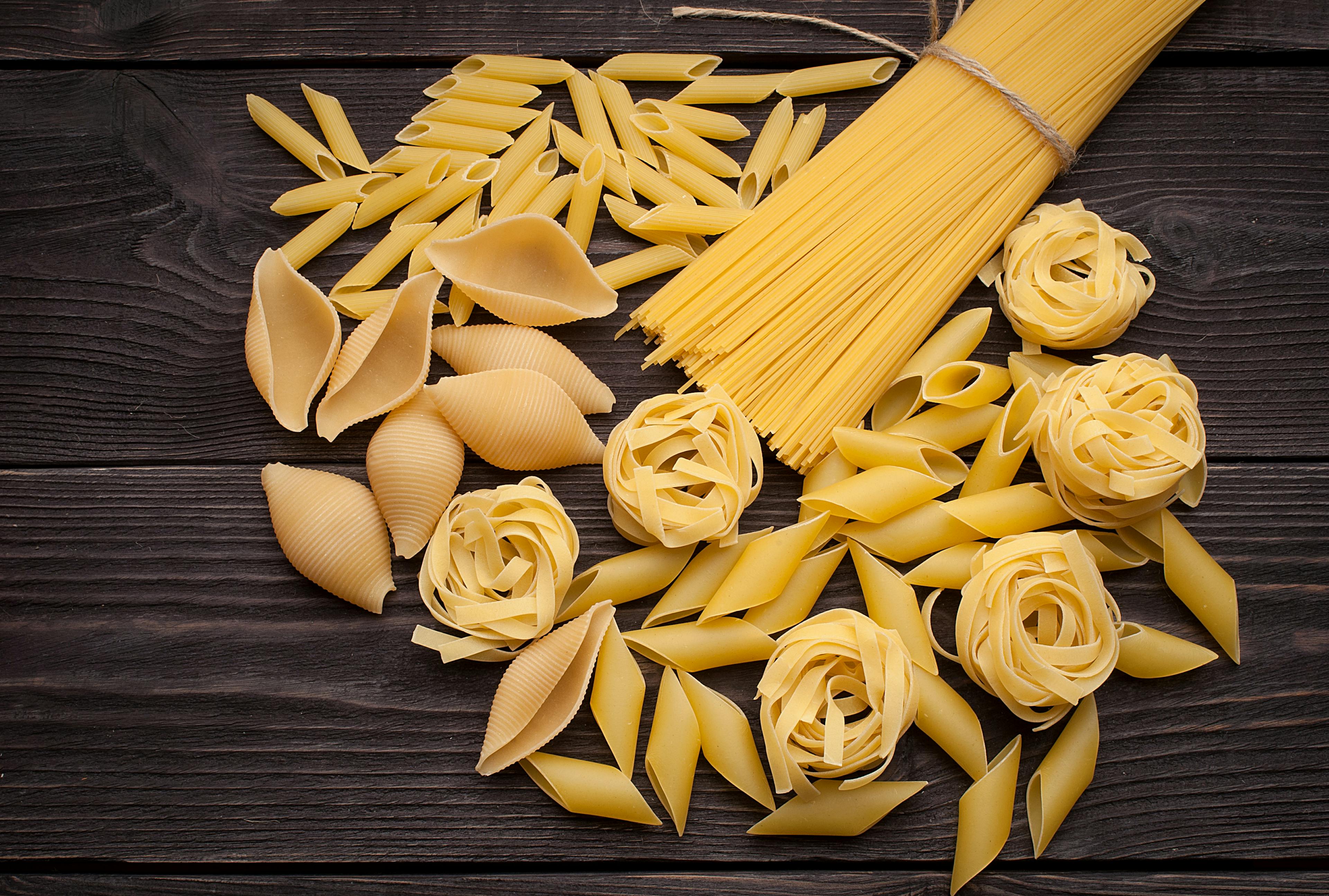 Various types of dried pasta on the table