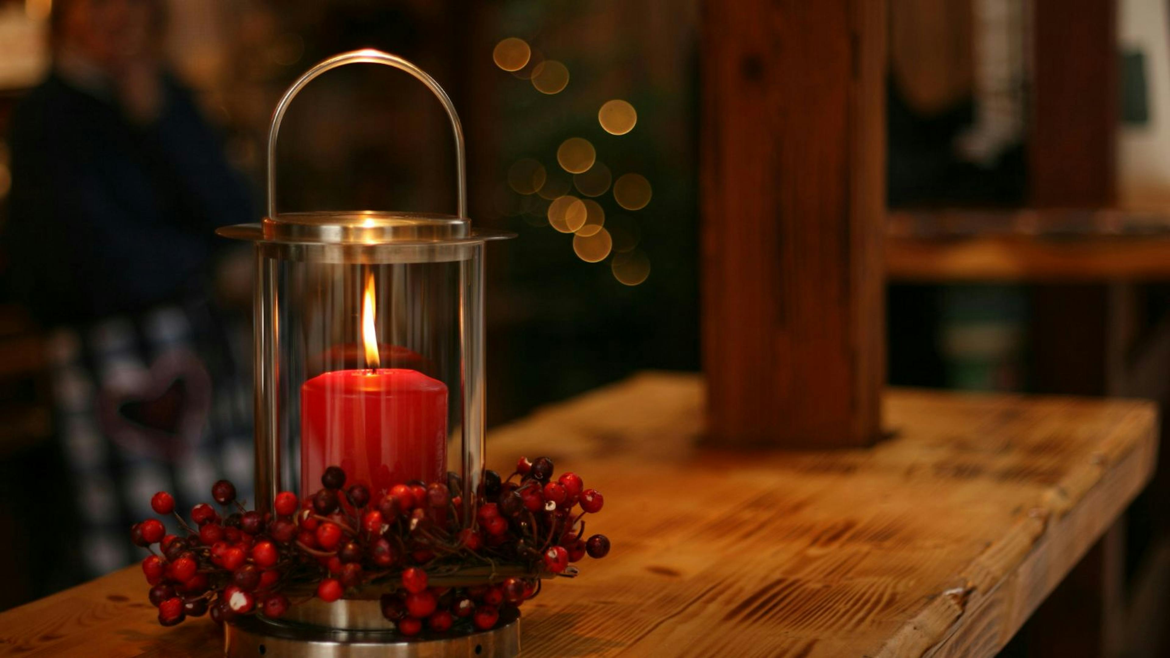 red candle on the table