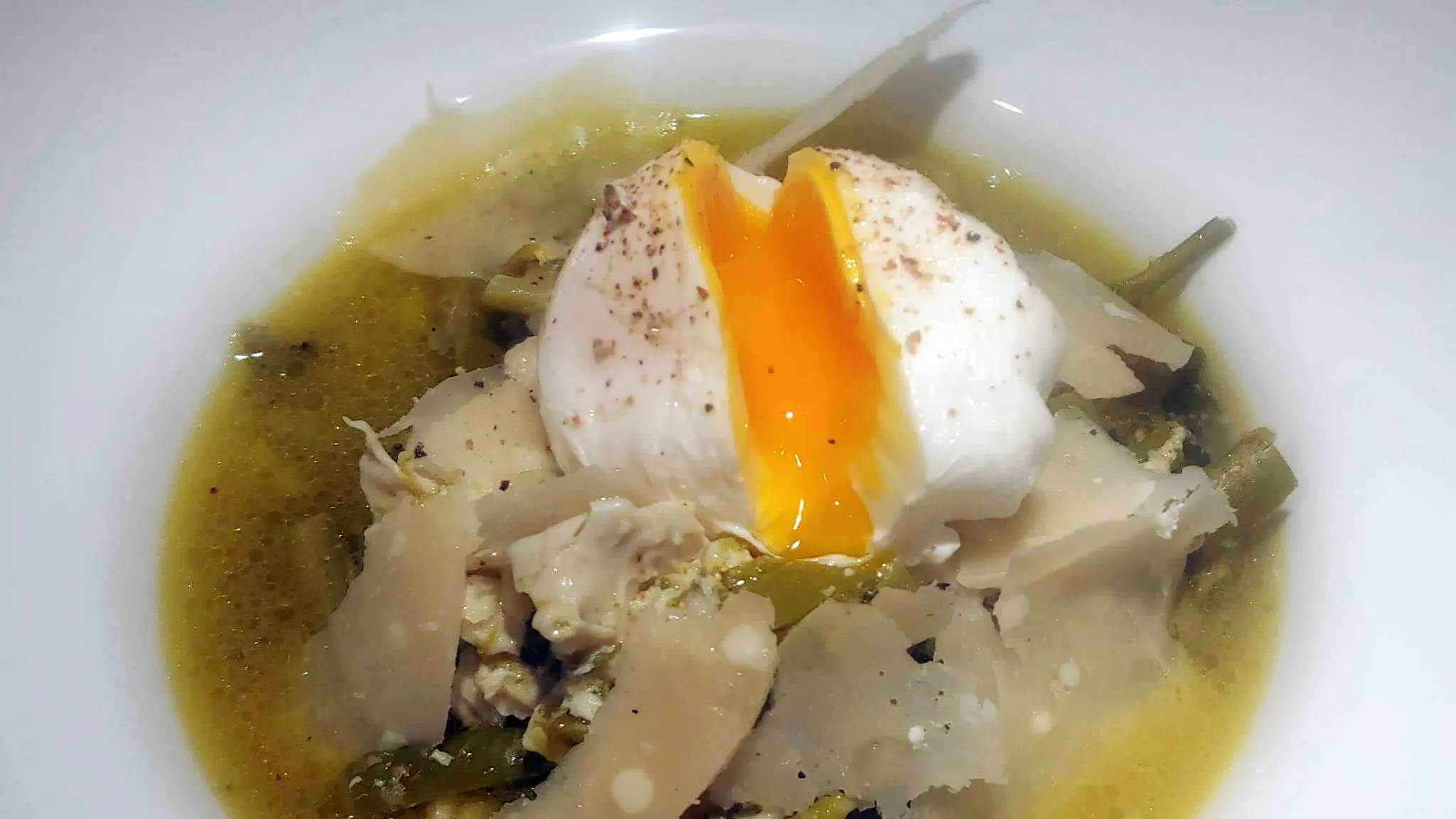 Asparagus consommé with poached egg and parmesan