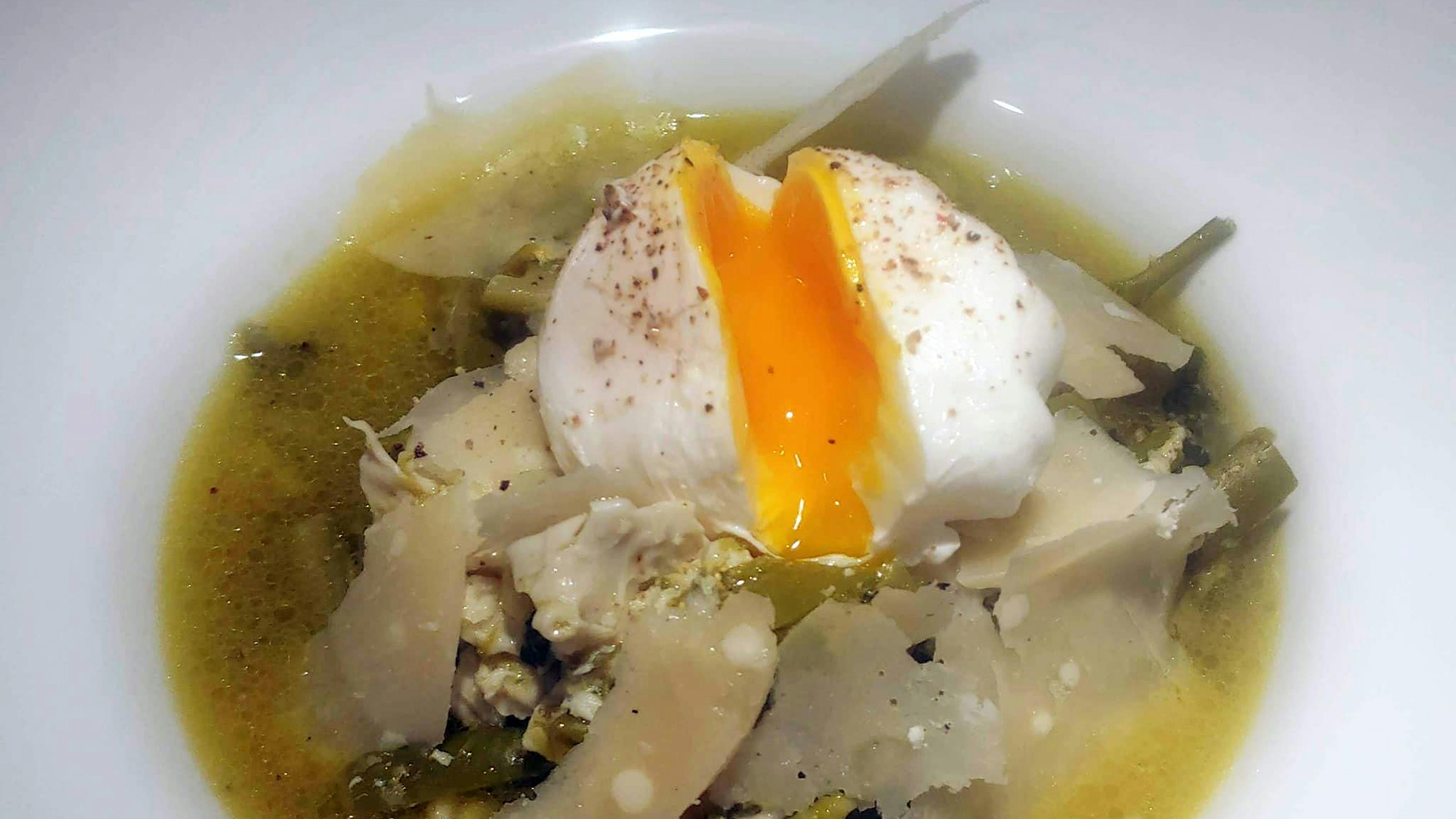 Asparagus consommé with poached egg and parmesan