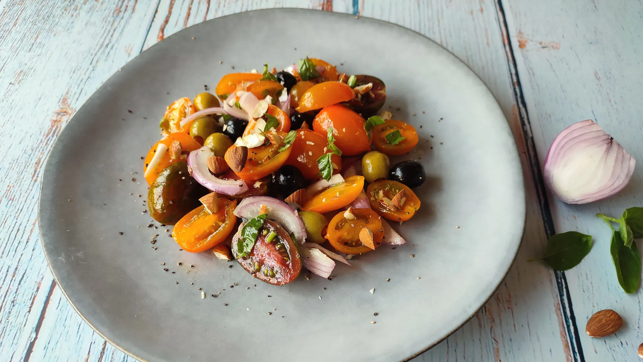 Cesarina Francesca’s summer salad with multicolored cherry tomatoes, basil, and almonds
