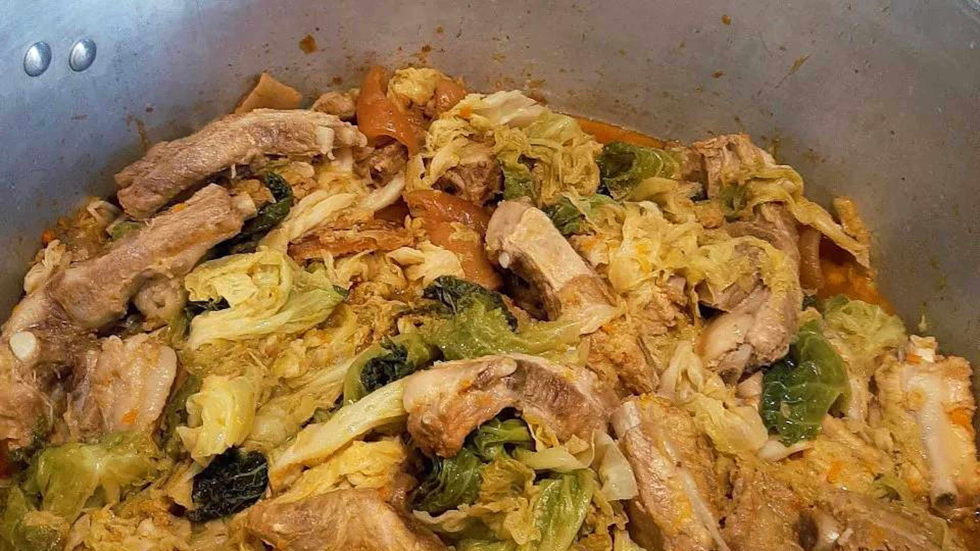 Italian pork and cabbage stew (Cassoeula) served in a pan