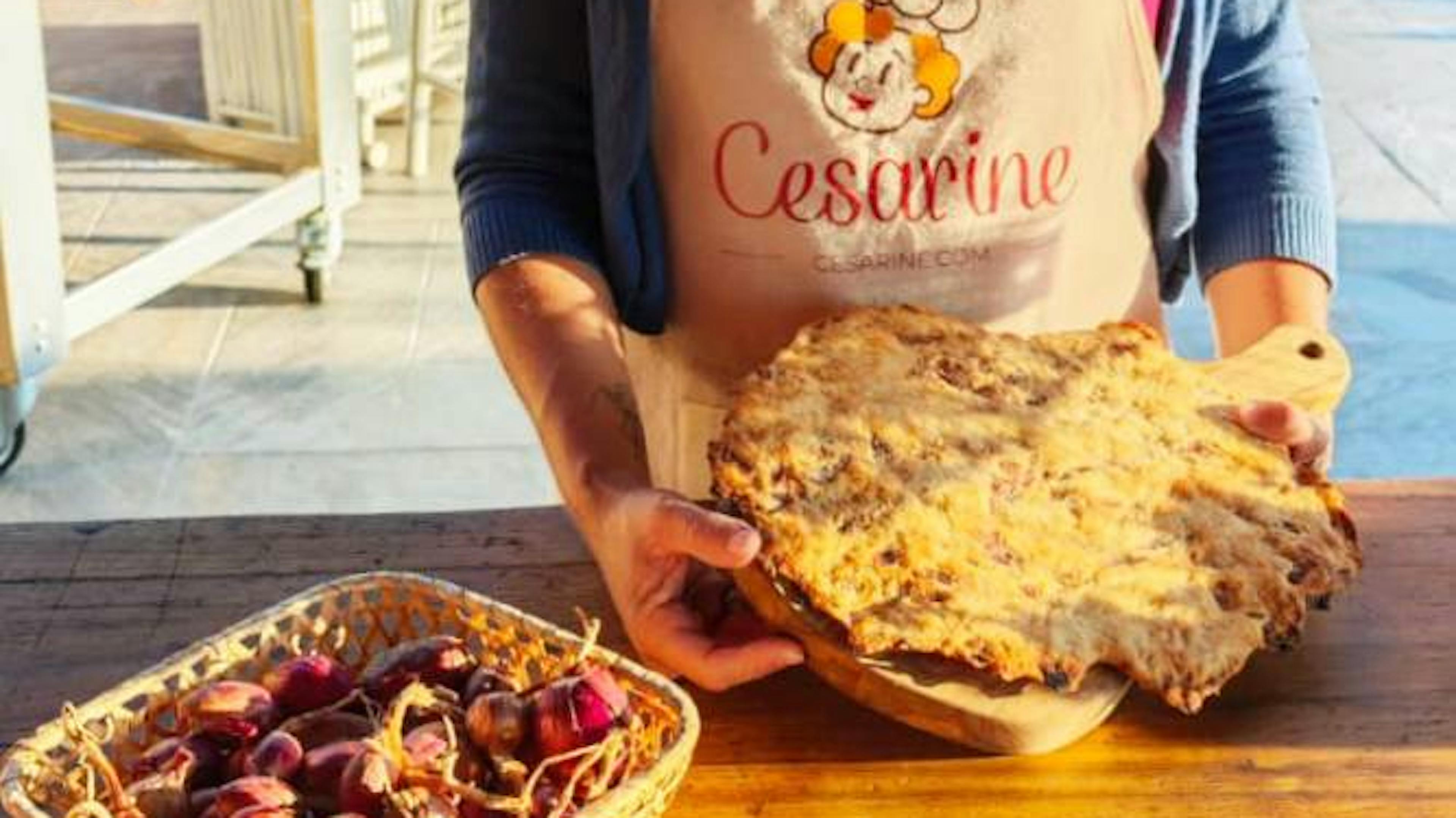 Cesarina Lara showing Scrocchiarella, a crispy Tuscan flatbread with Certaldo onion