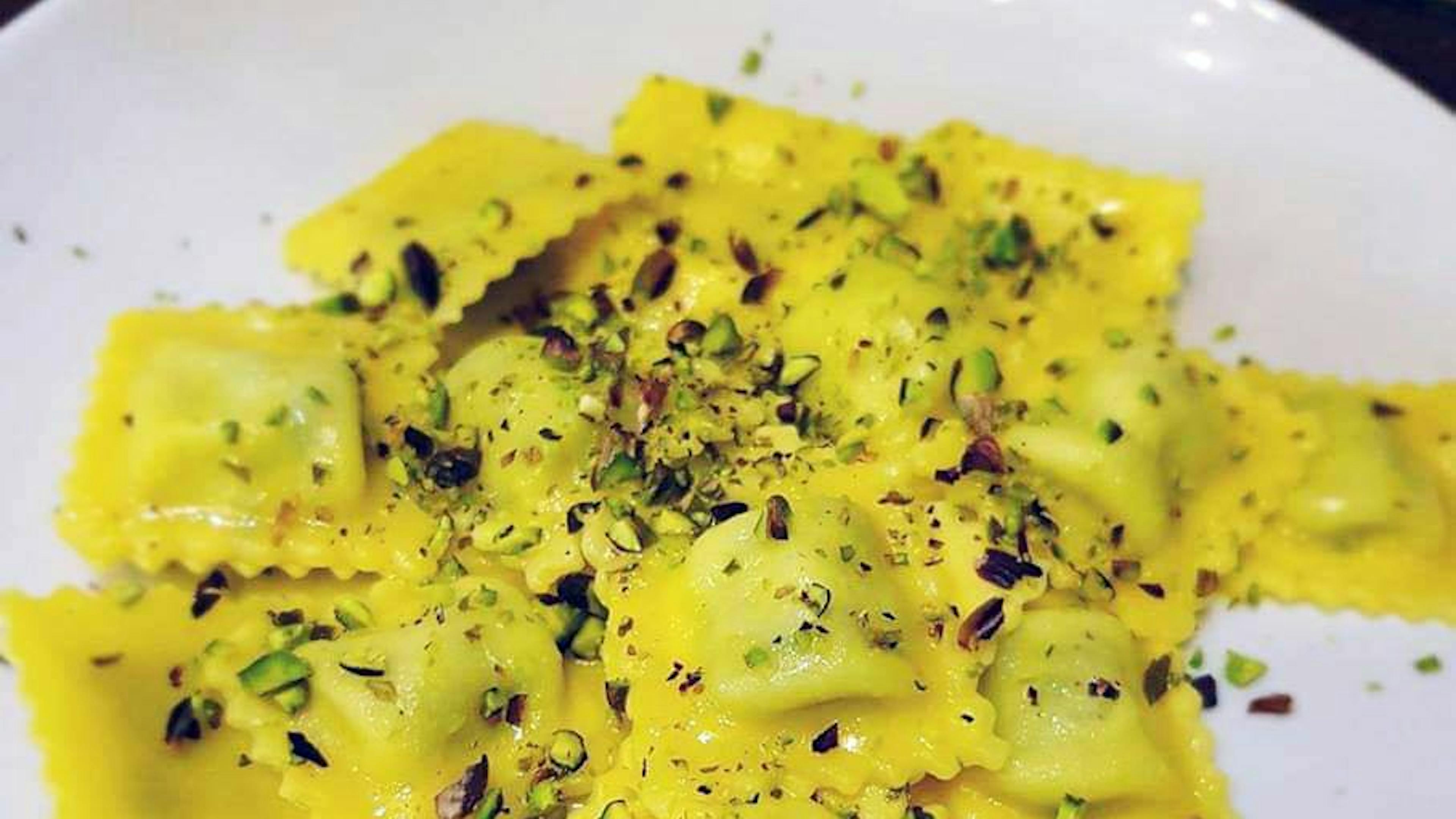 Pumpkin and pancetta tortelli topped with butter and sage
