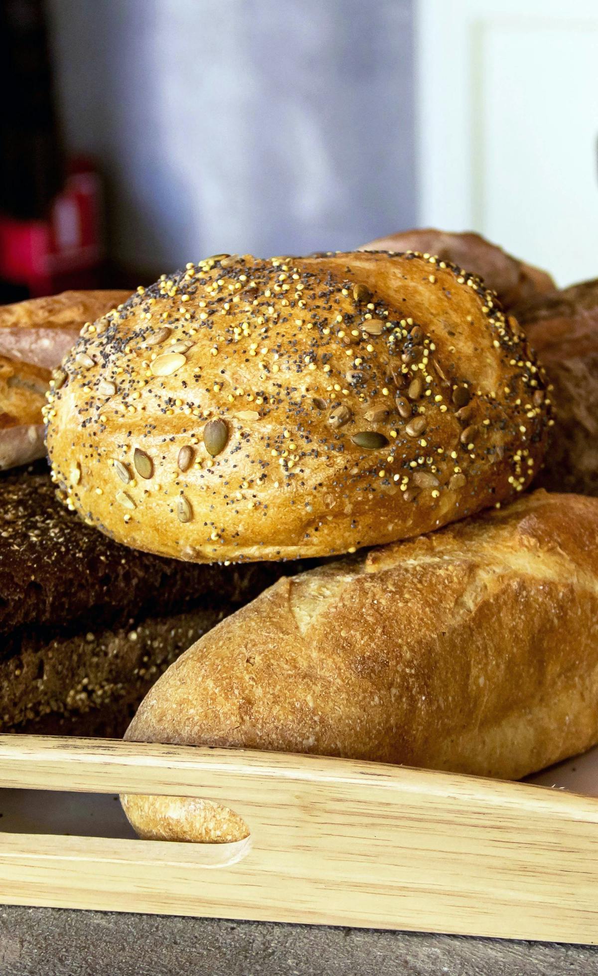 Assorted bread loaves arranged on a tray