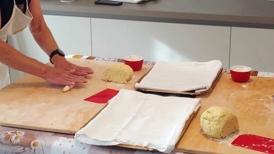 Preparing potato gnocchi on a cutting board