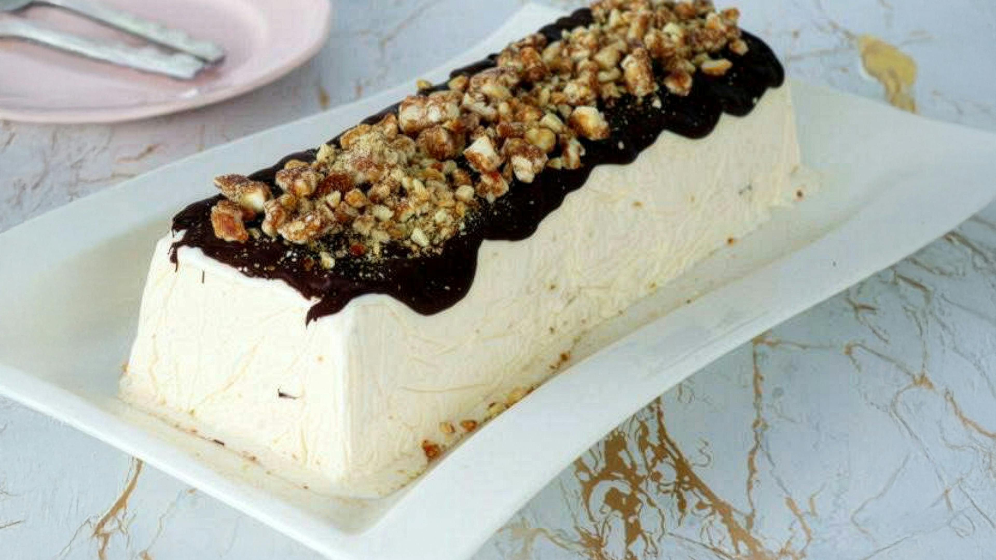Almond parfait with warm chocolate sauce, classic Sicilian dessert