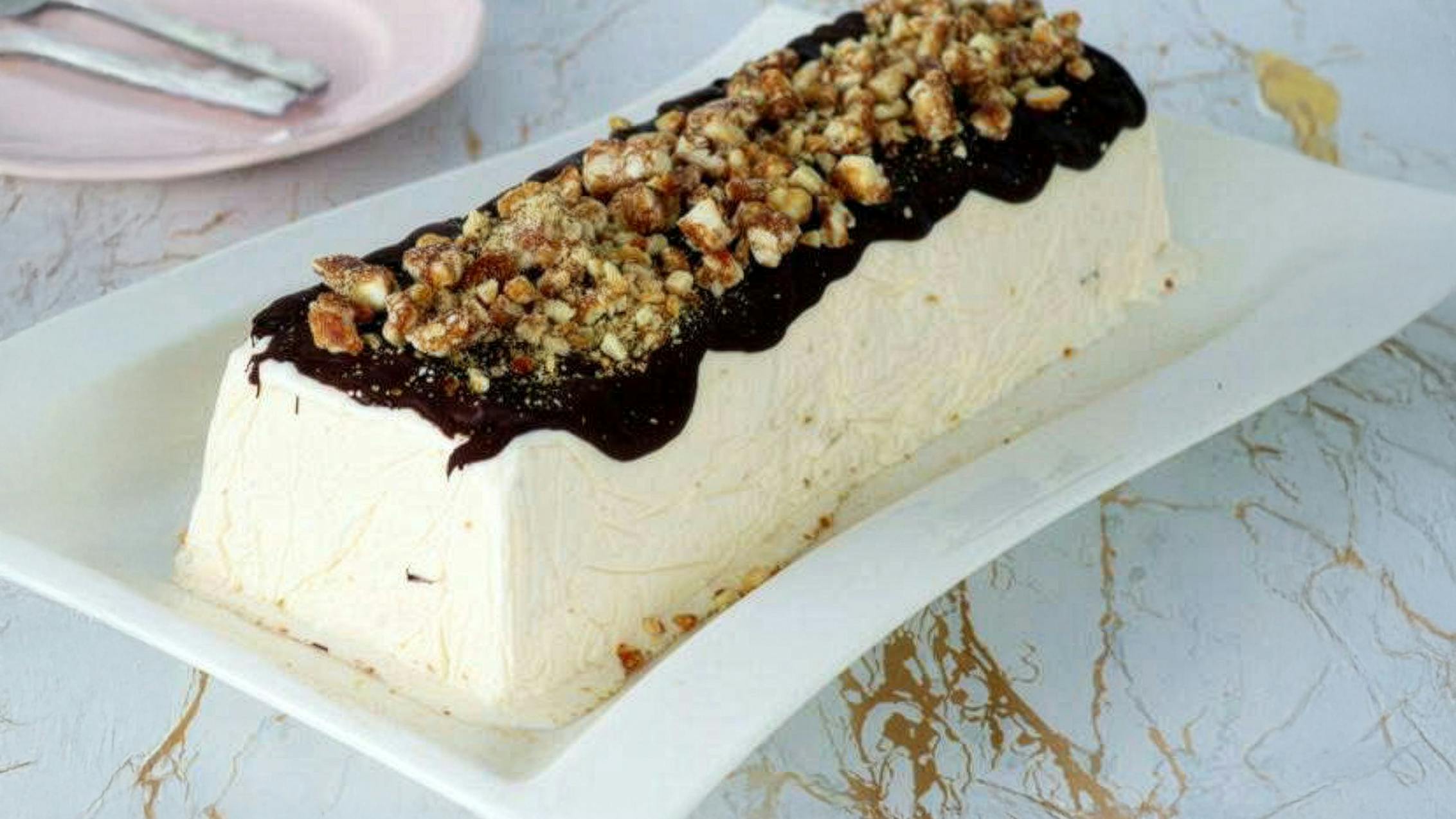 Almond parfait with warm chocolate sauce, classic Sicilian dessert