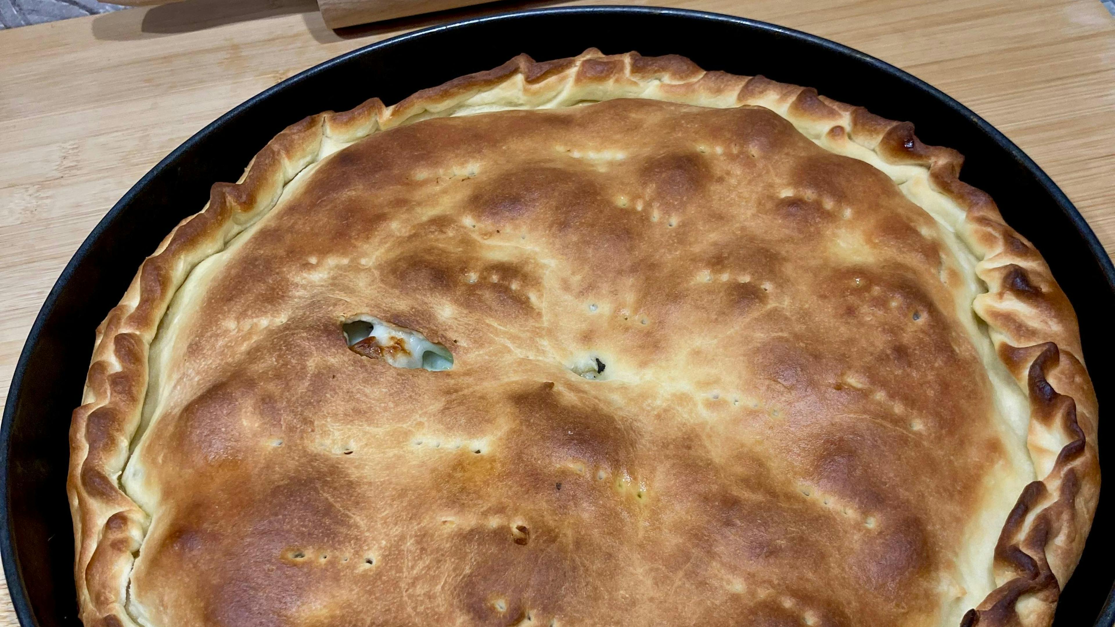 Catanese Scacciata: the savory pie typical of Eastern Sicily, a flaky crust enclosing a rich and flavorful filling