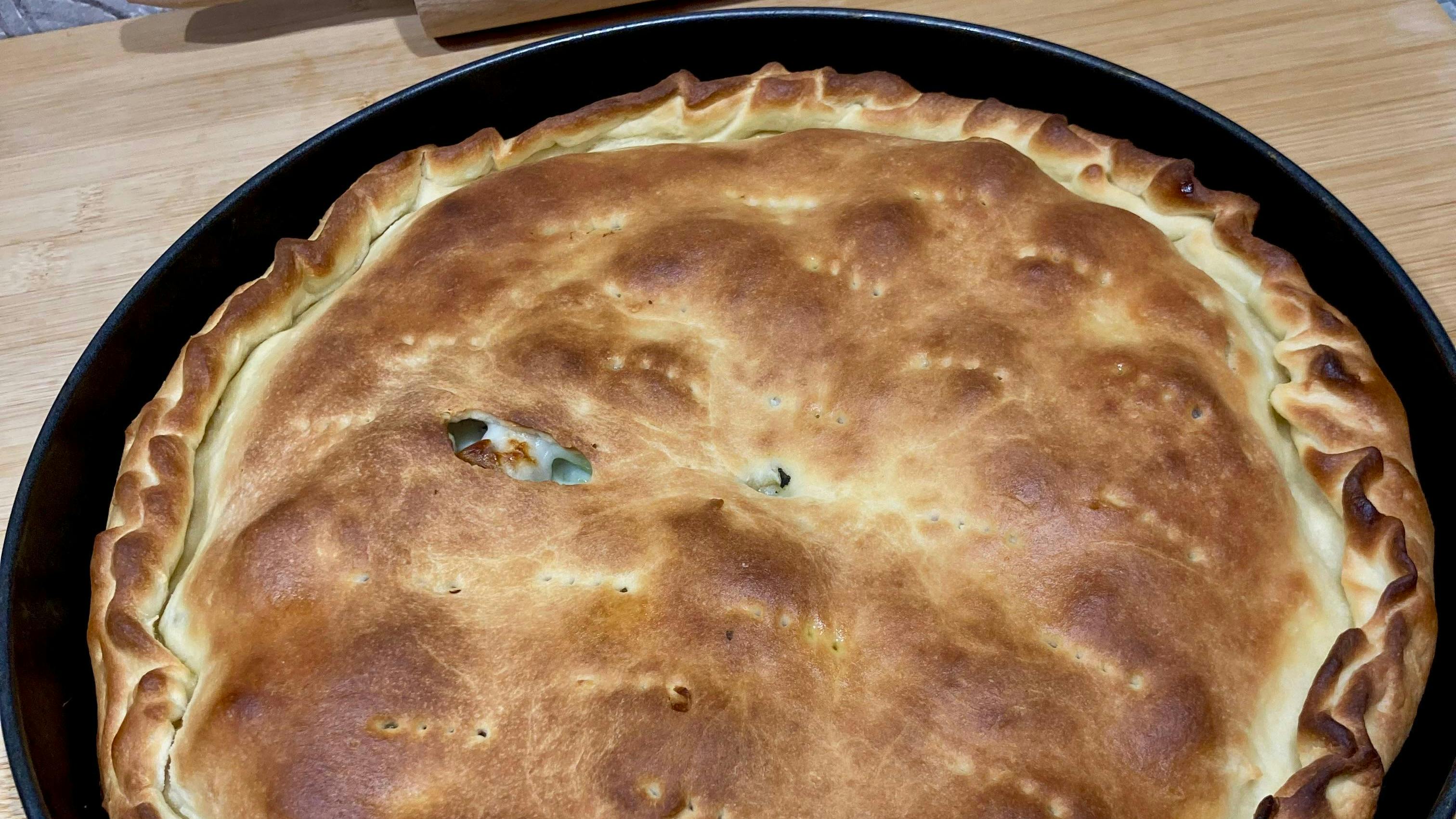 Catanese Scacciata: the savory pie typical of Eastern Sicily, a flaky crust enclosing a rich and flavorful filling