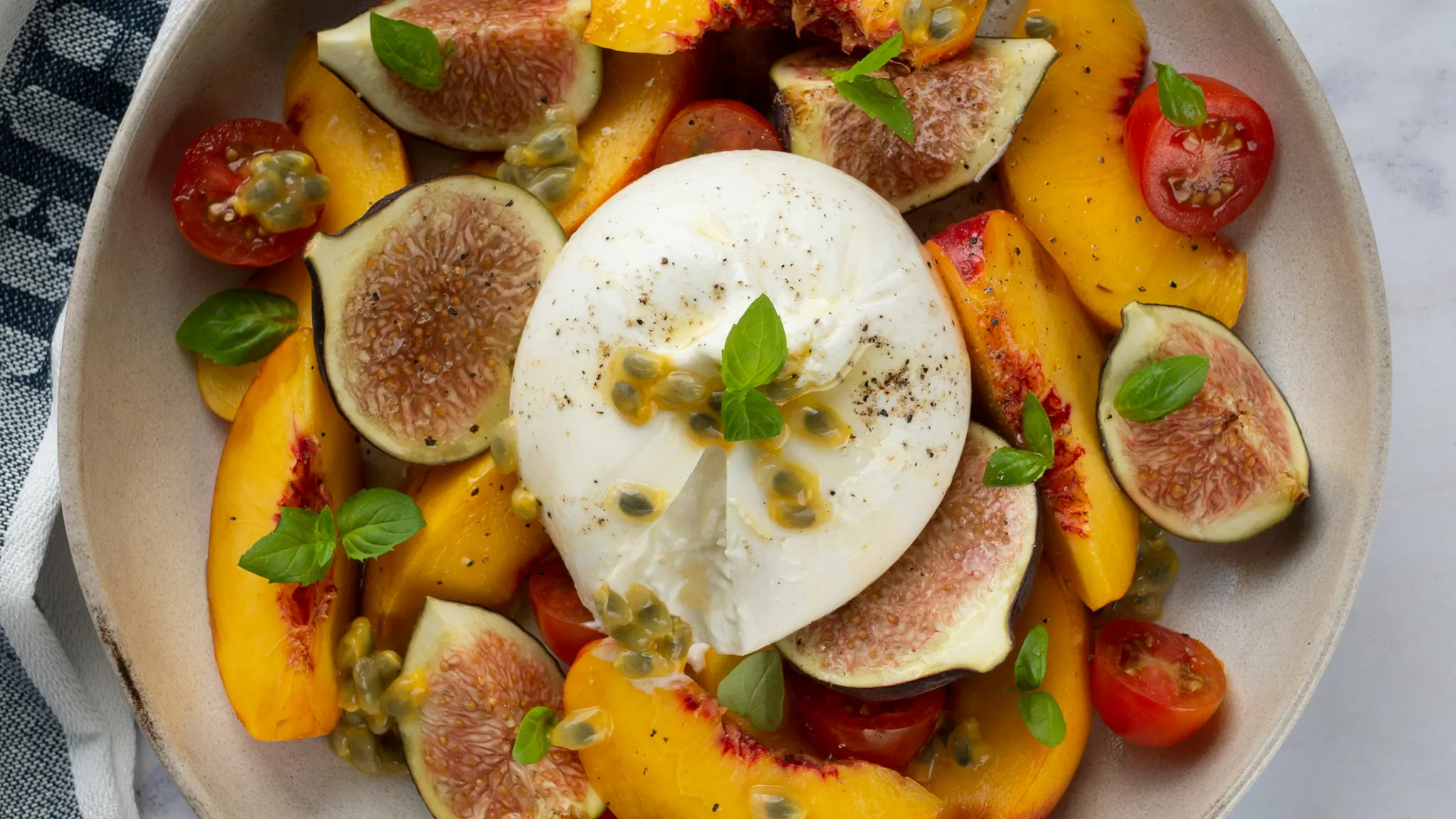 Burrata in fruit salad
