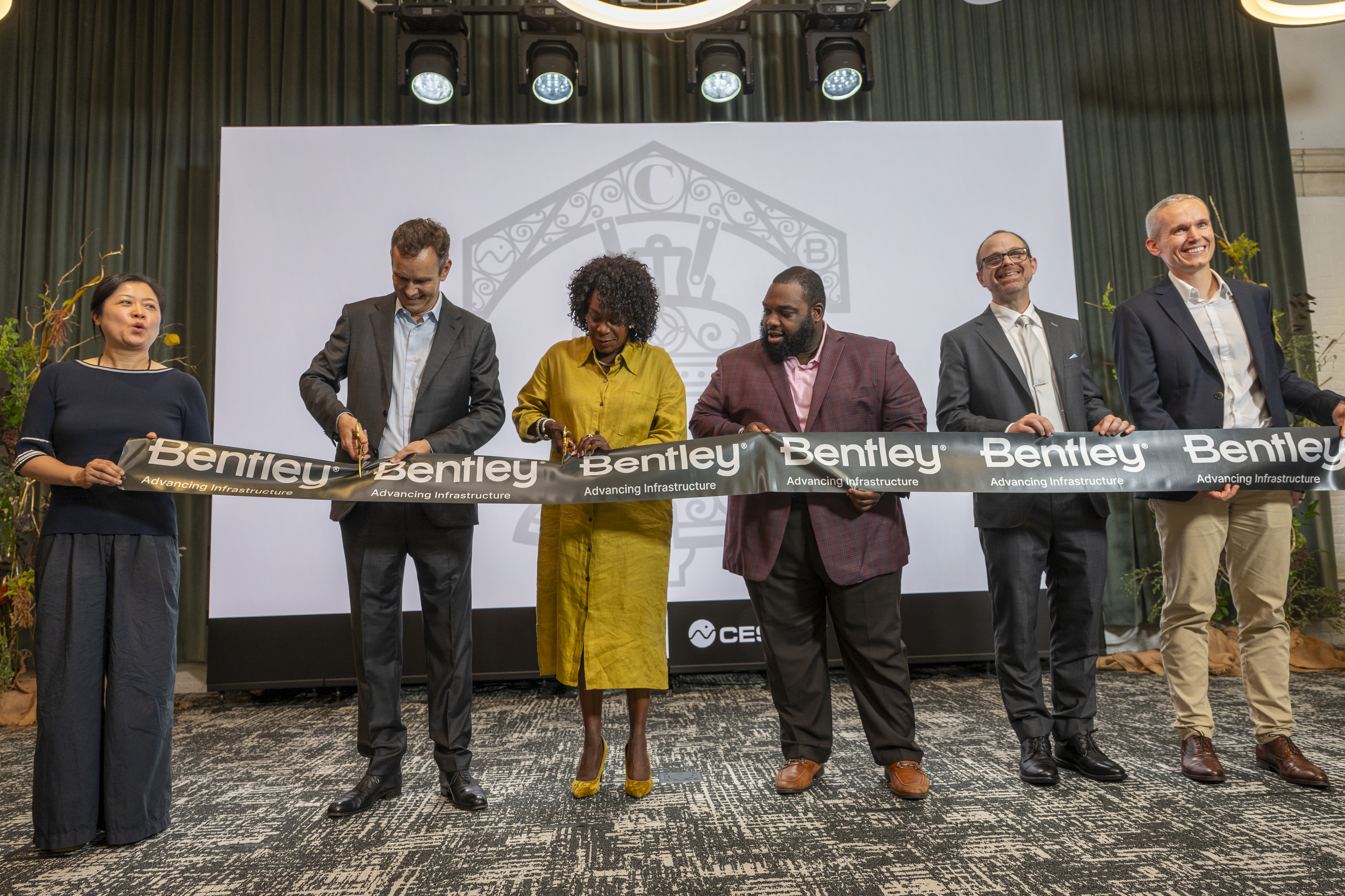 ribbon cutting at the Philadelphia office opening. Left to right: Florence Zheng, Chief People Officer, Bentley Systems; Nicholas Cumins, Chief Executive Officer, Bentley Systems; Cherelle Parker, Mayor of the City of Philadelphia; Jordan A. Harris, Pennsylvania House Appropriations Committee Majority Chair; Patrick Cozzi, Chief Platform Officer, Bentley Systems/Founder, Cesium; Julien Moutte, Chief Technology Officer, Bentley Systems