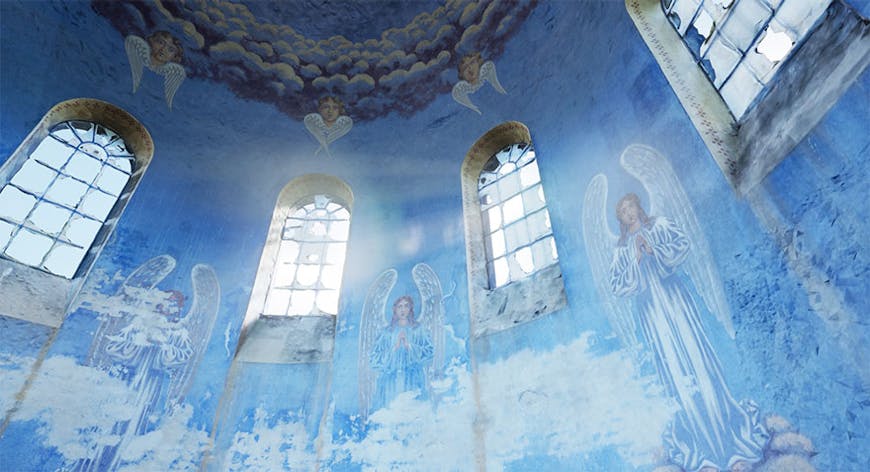 Close up of the domed ceiling of the historic Oleszyce Church in Poland, the wall of which is painted sky blue with angels