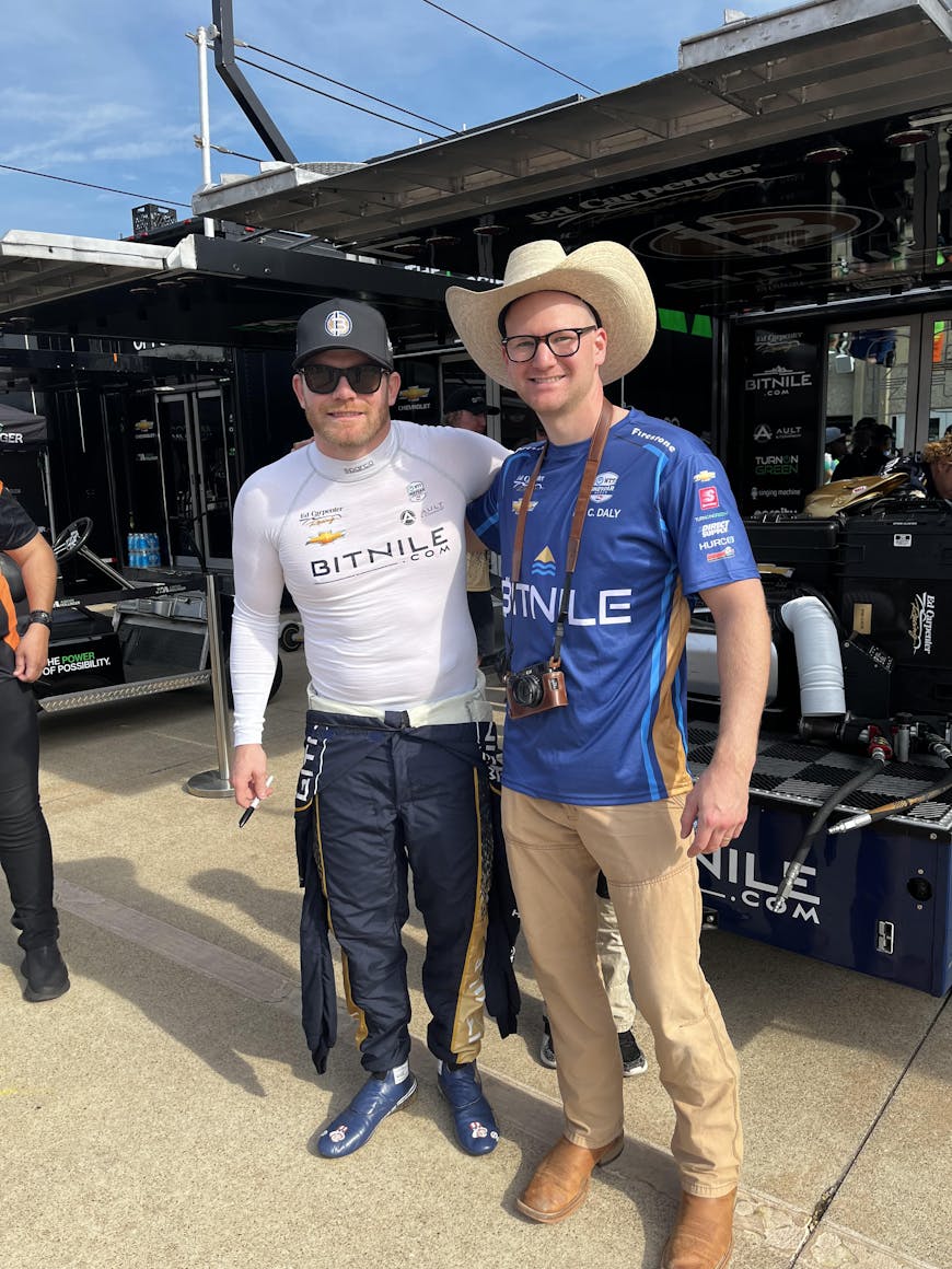 Jason Sobotka (right) stands with IndyCar driver Conor Daly.