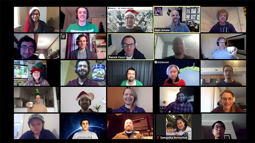 Screenshot from Zoom meeting between Cesium employees wearing a variety of Santa hats and festive attire.