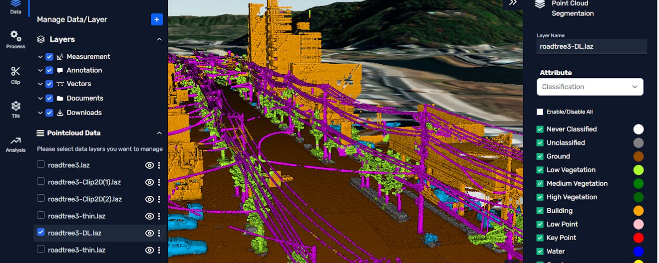 Point cloud of Shizuoka, Japan, with classifications including vegetation, cars, buildings, and power lines. Cesium World Terrain shows mountains just beyond the city.