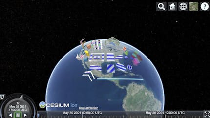 The Earth with geometric shapes in various colors and patterns seen in a sandcastle