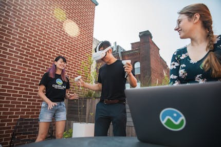 Gabby Getz, with Janine Liu and Xuelong Mu, testing VR applications in Cesium