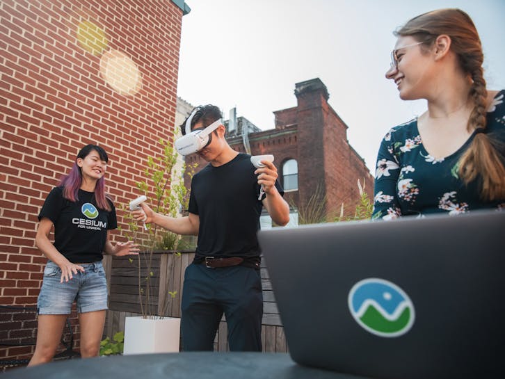 Gabby Getz, with Janine Liu and Xuelong Mu, testing VR applications in Cesium