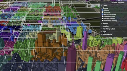A 3D Tiles city styled so that buildings in different tiles are shown in different colors and so each tile's bounding volume is outlined as a box.