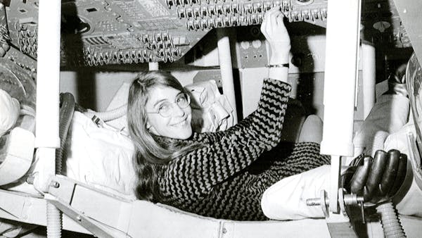Margaret Hamilton, lead Apollo flight software engineer, in the Apollo Command Module.