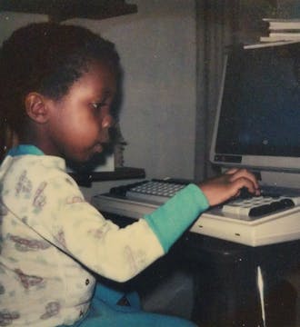 James McClain as a young child, typing at a computer