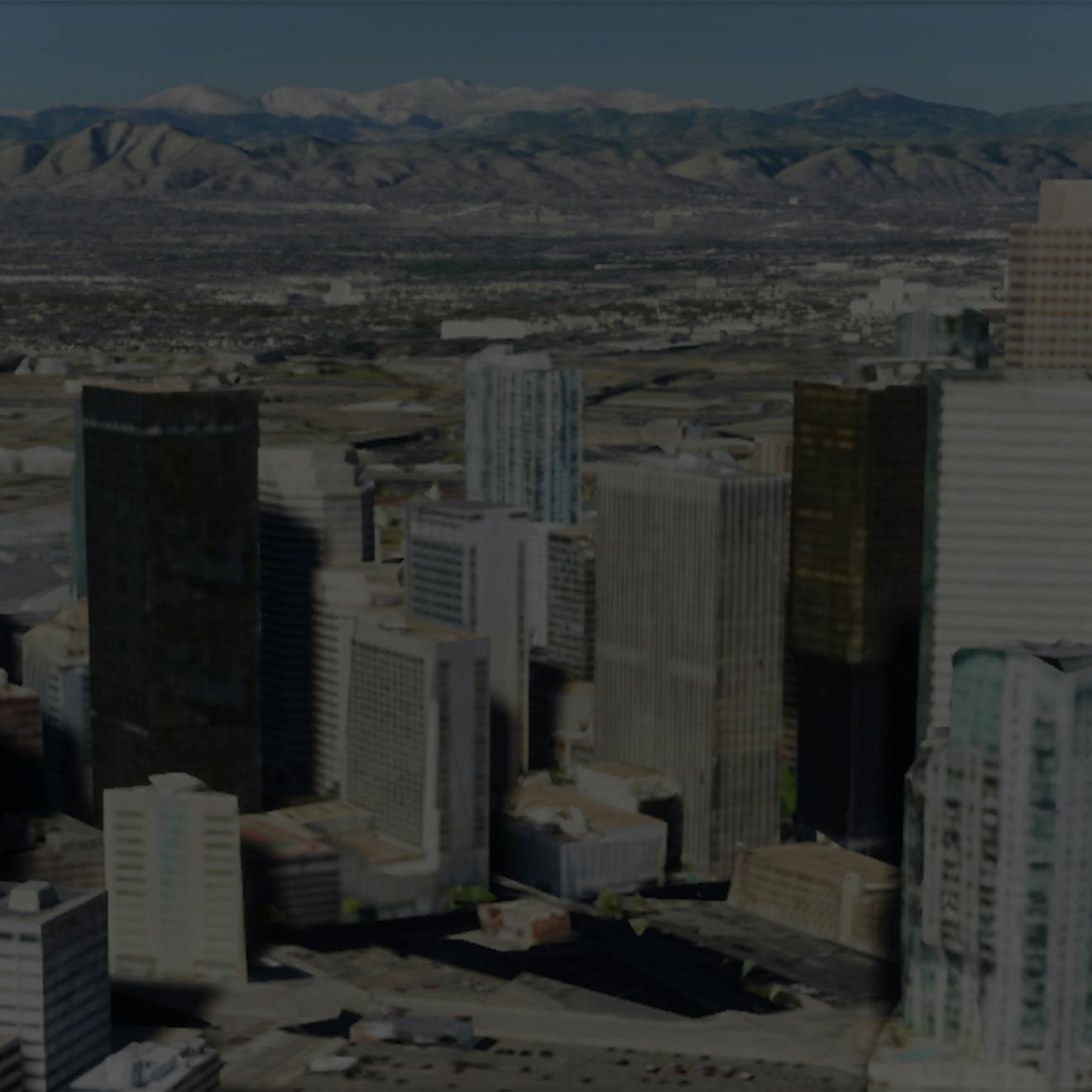 Denver skyline from the air with mountains in the background, taken in Unreal