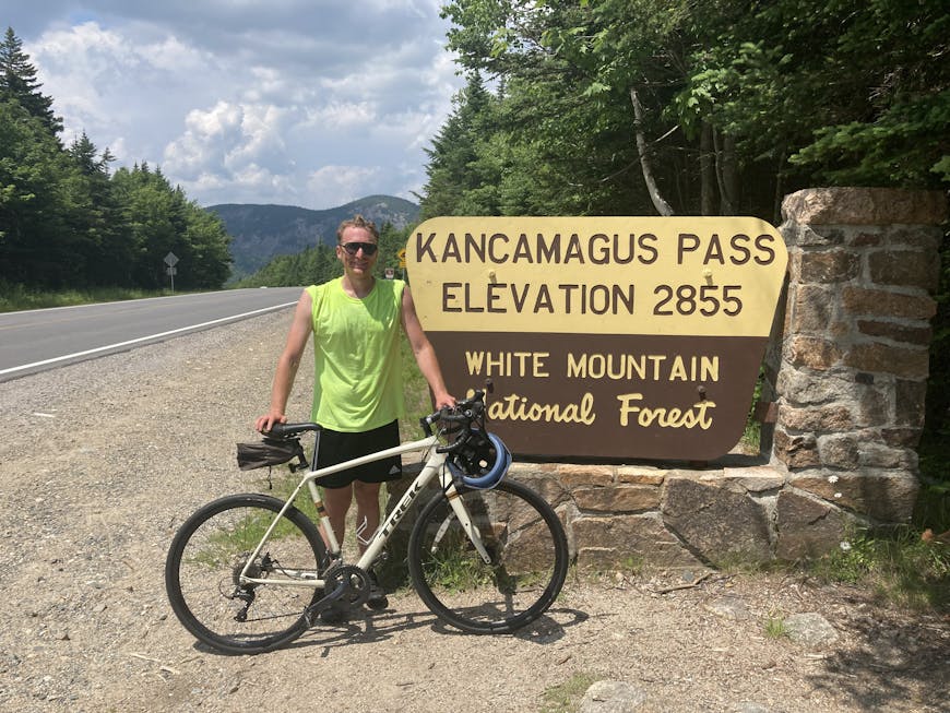 Luke McKinstry with a mountain bike at Kancamagus Pass