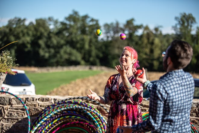 Cesium team member Hannah Pinkos teaches Alex to juggle at a refactor event in 2021.