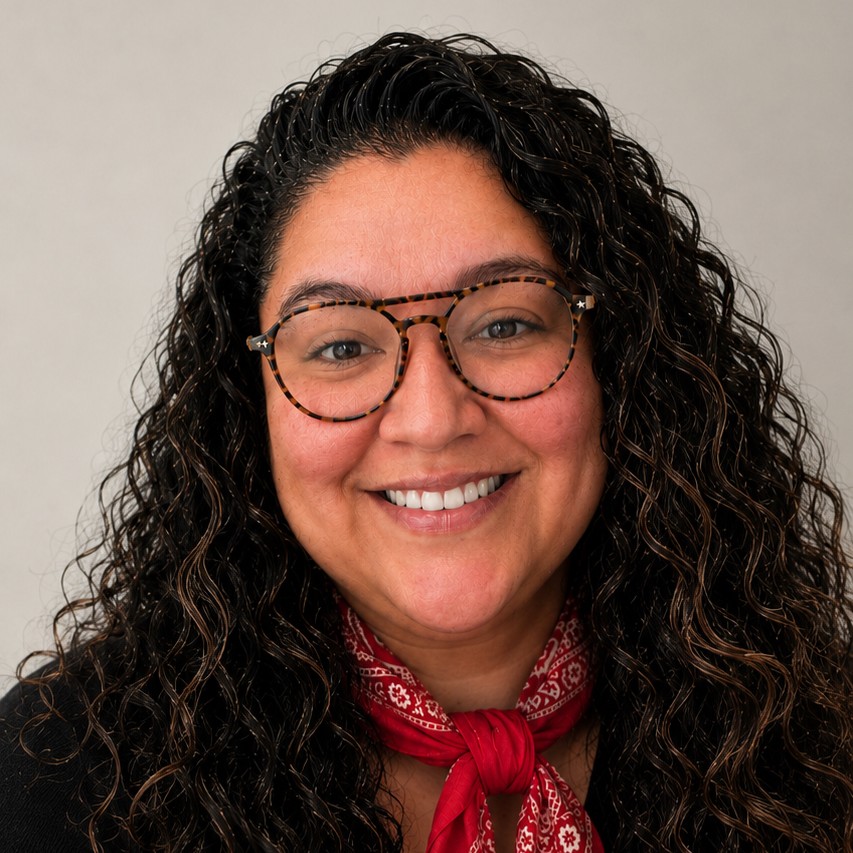 A photo of Staph Marquez wearing round glasses and a red bandana