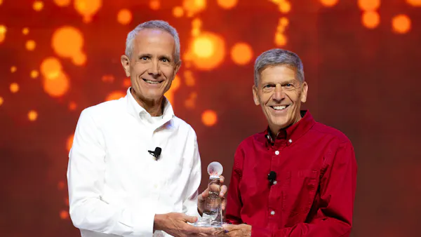 Richard Hipp and Keith Bentley, as Hipp receives Bentley Lifetime Achievement Award at 2026 Cesium Developer Conference.
