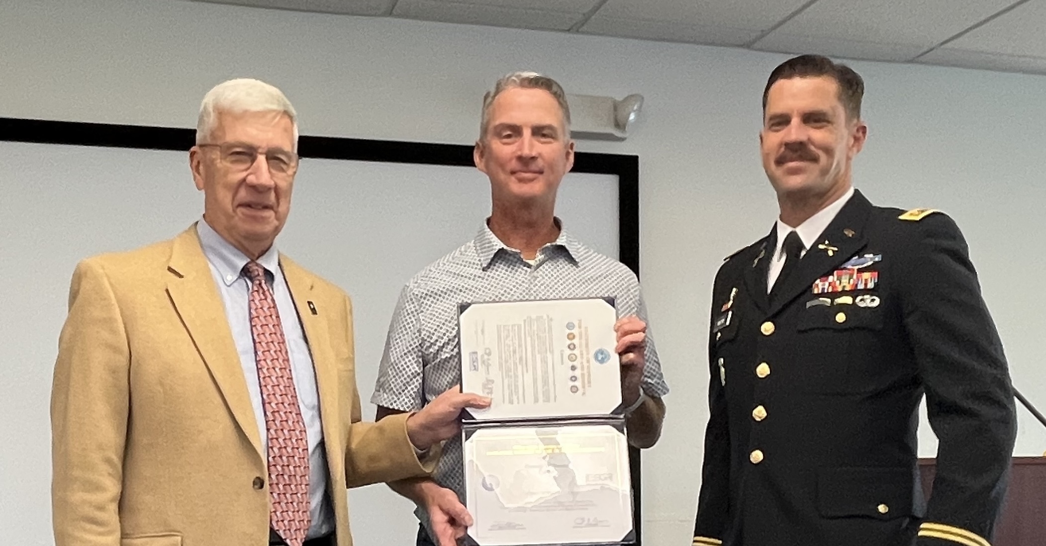 Wes Craig, Danny Williams, and Brady Moore during the award ceremony.