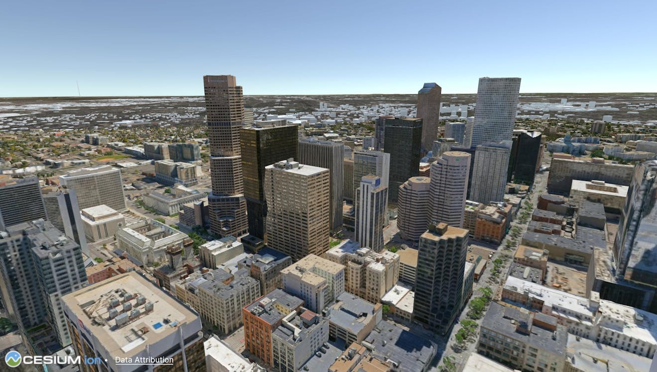 3D buildings in Denver from Aerometrex photogrammetry dataset surrounded by Cesium OSM building models