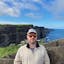 Mike Frederick, senior software engineer, focused on infrastructure. In this photo, he is at the Cliffs of Moher, Ireland.