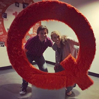 Matt Boyd Surka and friend posing with a giant red Q. 
